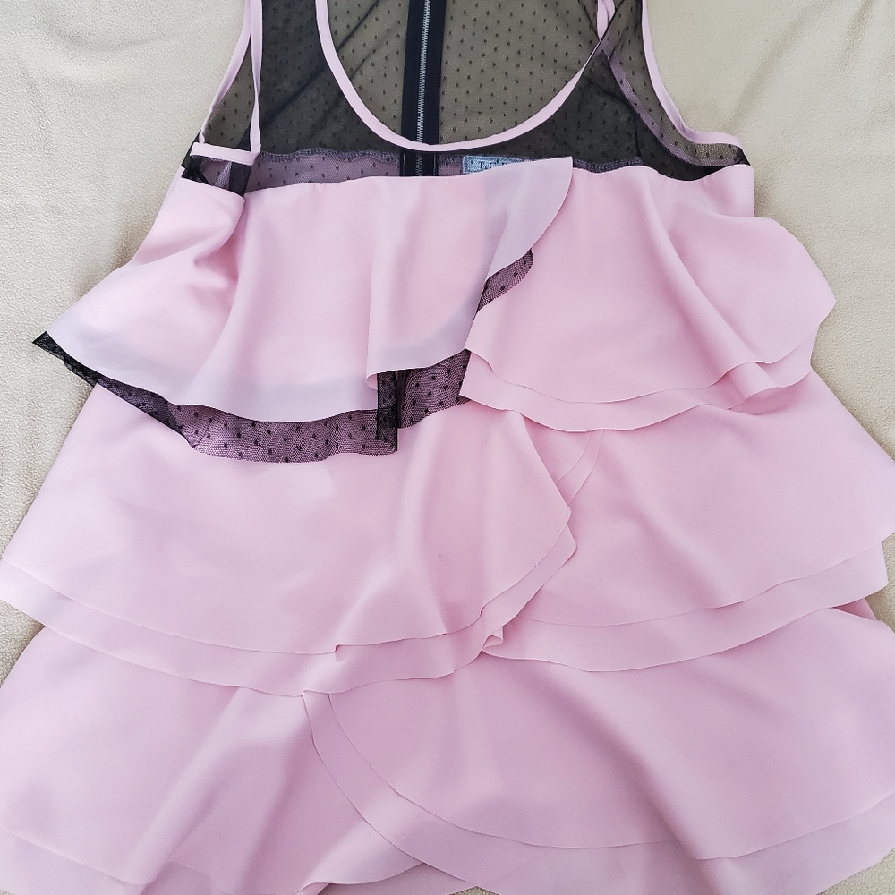 Pink and black sleevless blouse.